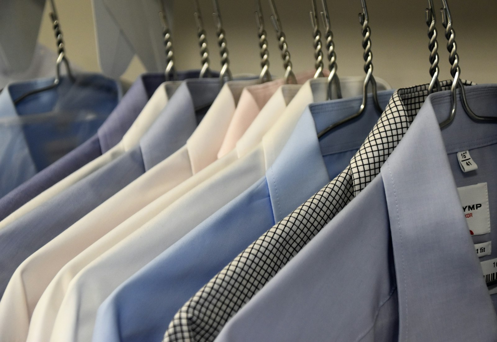 Freshly cleaned suits and shirts on hangers
